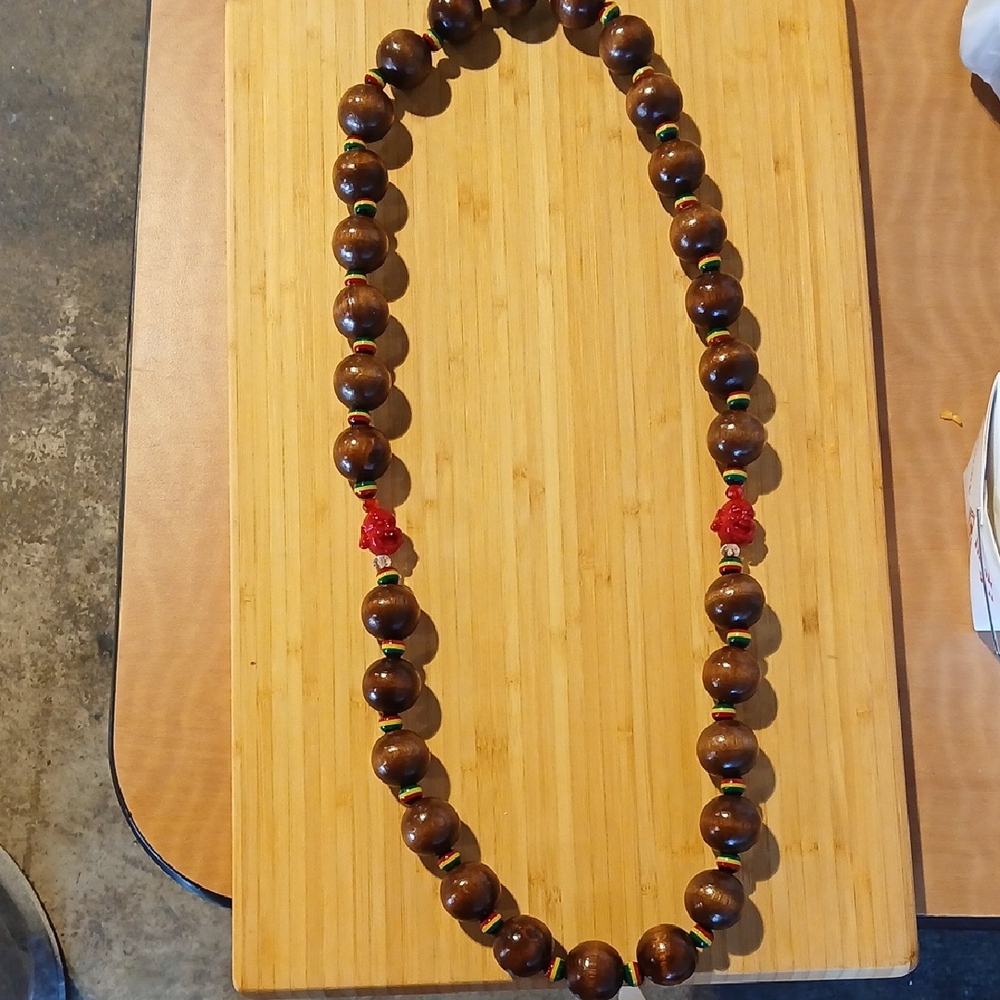 Elegant Brown Beaded Necklace with Red Buddha Accents